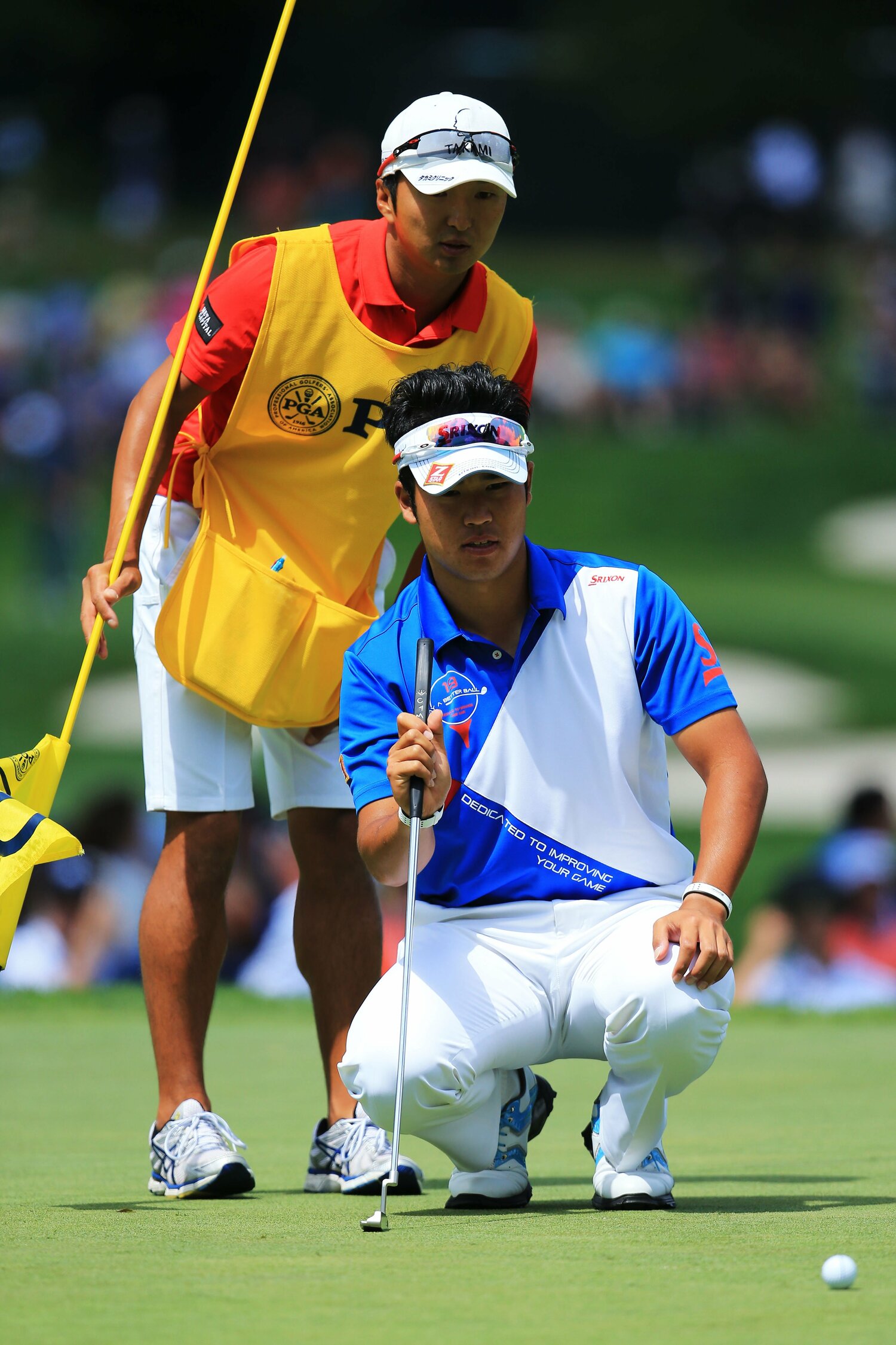 2013年全米プロ（左は進藤キャディ）©︎Getty Images