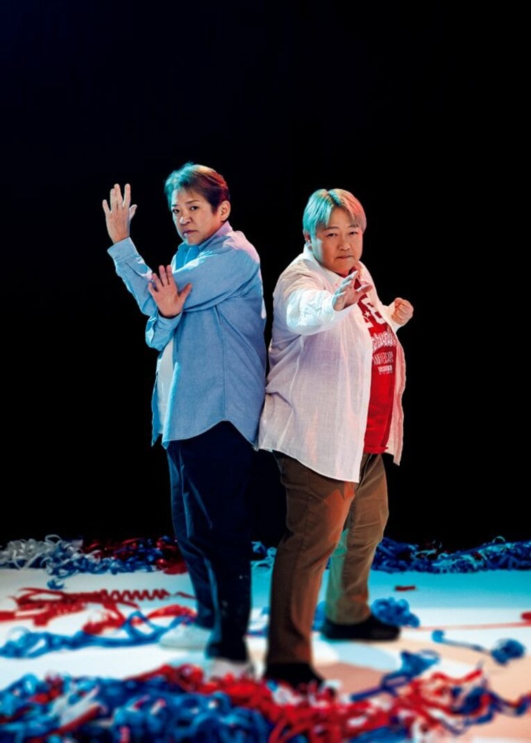 （右）長与千種（ながよ・ちぐさ）／1964年12月8日生、長崎県出身。'80年全日本女子プロレスでデビュー。'89年に引退後、'93年に復帰。'94年自身の団体GAEA JAPANを設立する。里村芽衣子、加藤園子らを育て、2005年に2度目の引退。'14年、新団体マーベラスを設立。現在は同団体で後進を指導
（左）ライオネス飛鳥（らいおねす・あすか）／1963年7月28日生、埼玉県出身。'80年全女でデビュー。'89年に引退し、長与復帰の翌年の'94年に自身も復帰。途中からヒール転向し旋風を巻き起こす。'98年からGAEA JAPANで長与と抗争を繰り広げたのち、'00年「クラッシュ2000」を結成した。'05年に2度目の引退　©︎Takuya Sugiyama