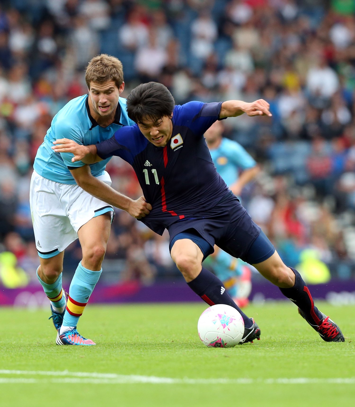 永井の執拗な高速プレスは明らかにスペインを苦しめていた　©︎Getty Images
