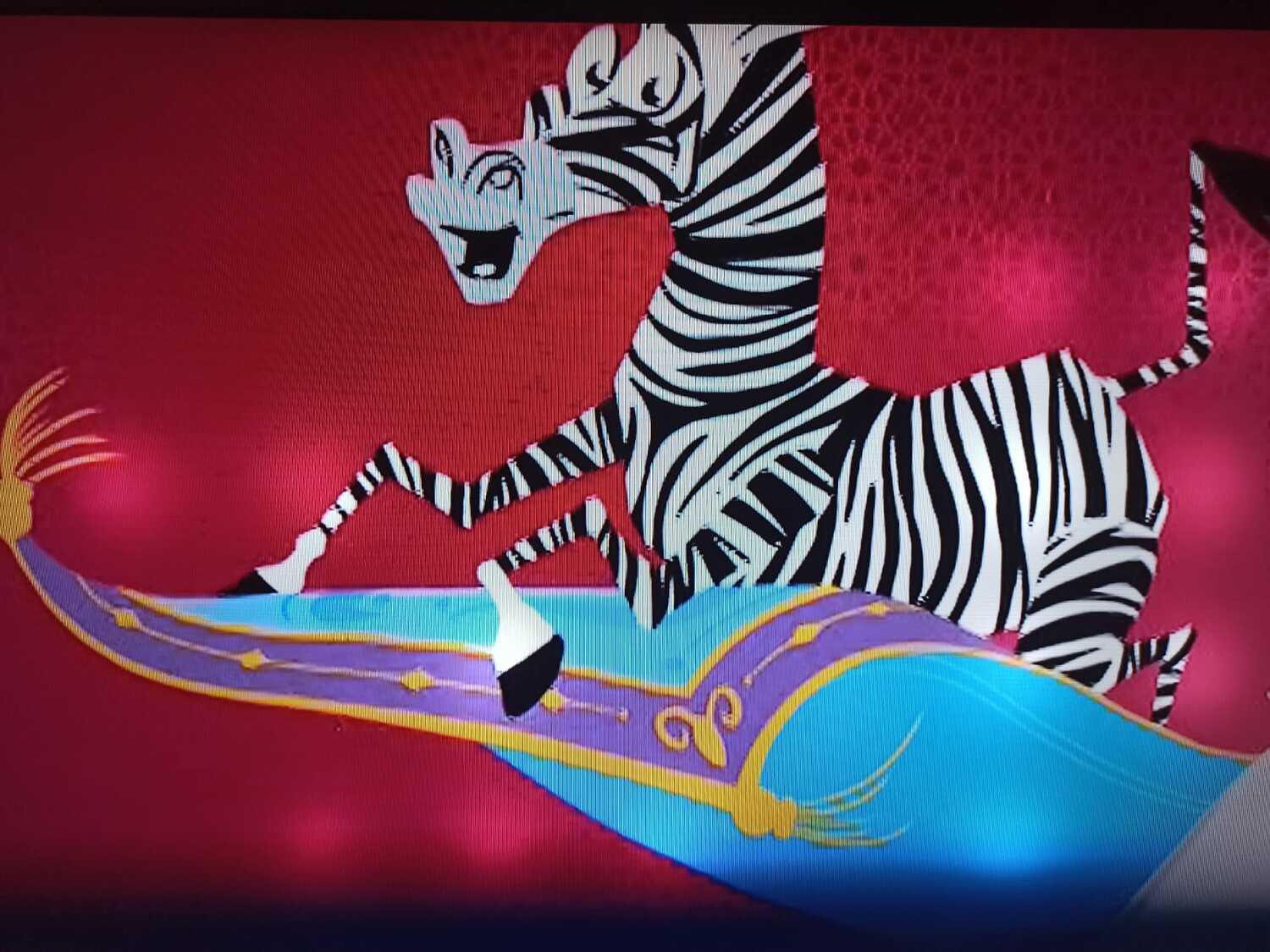 絨毯に乗って空を飛ぶシマウマ（ブラジルでは「番狂わせ」の象徴）＝番狂わせが起きると、TVグローボがこの映像を流す