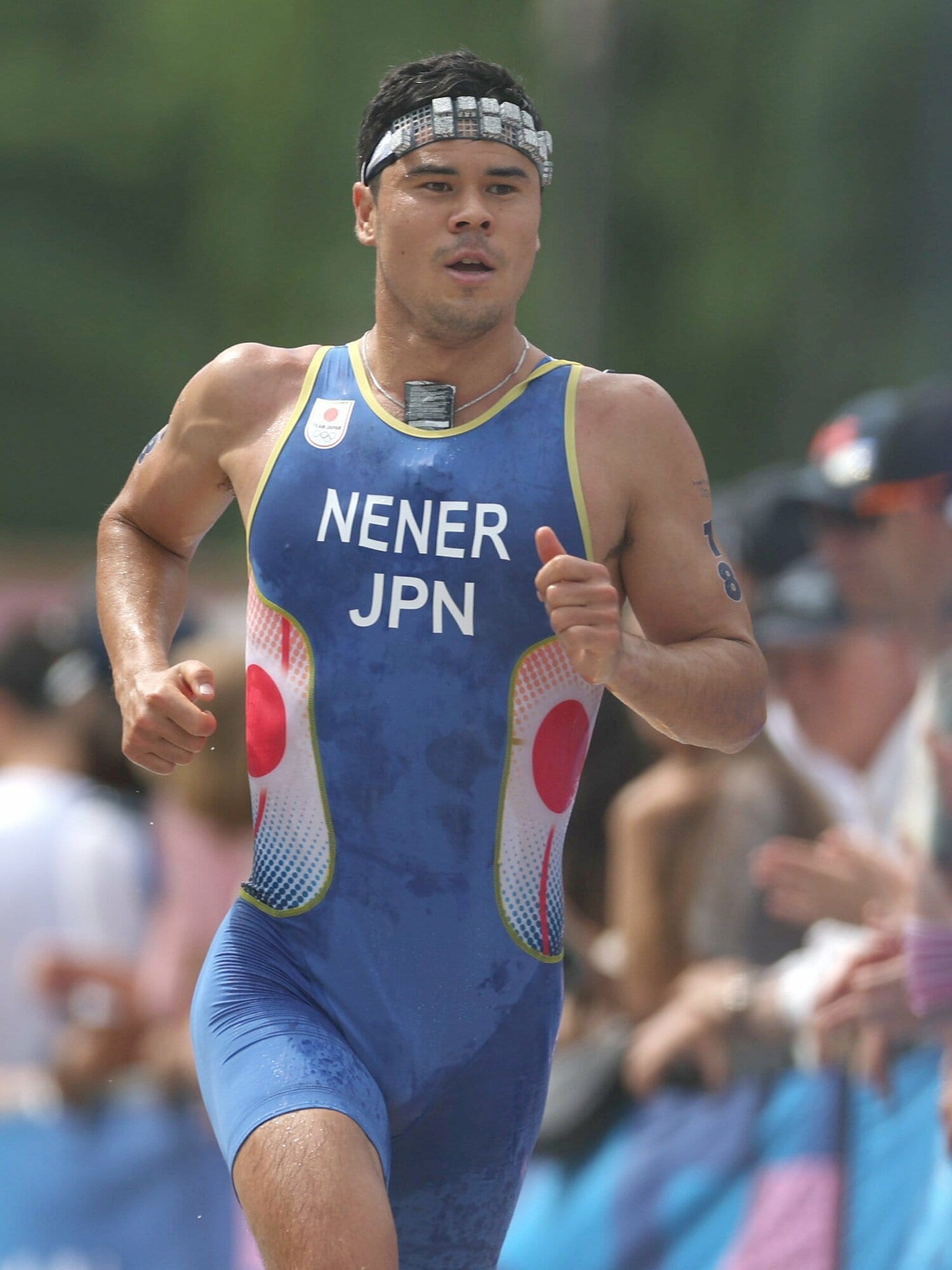 ランでゴールに向かうニナー賢治 ©JIJI PRESS