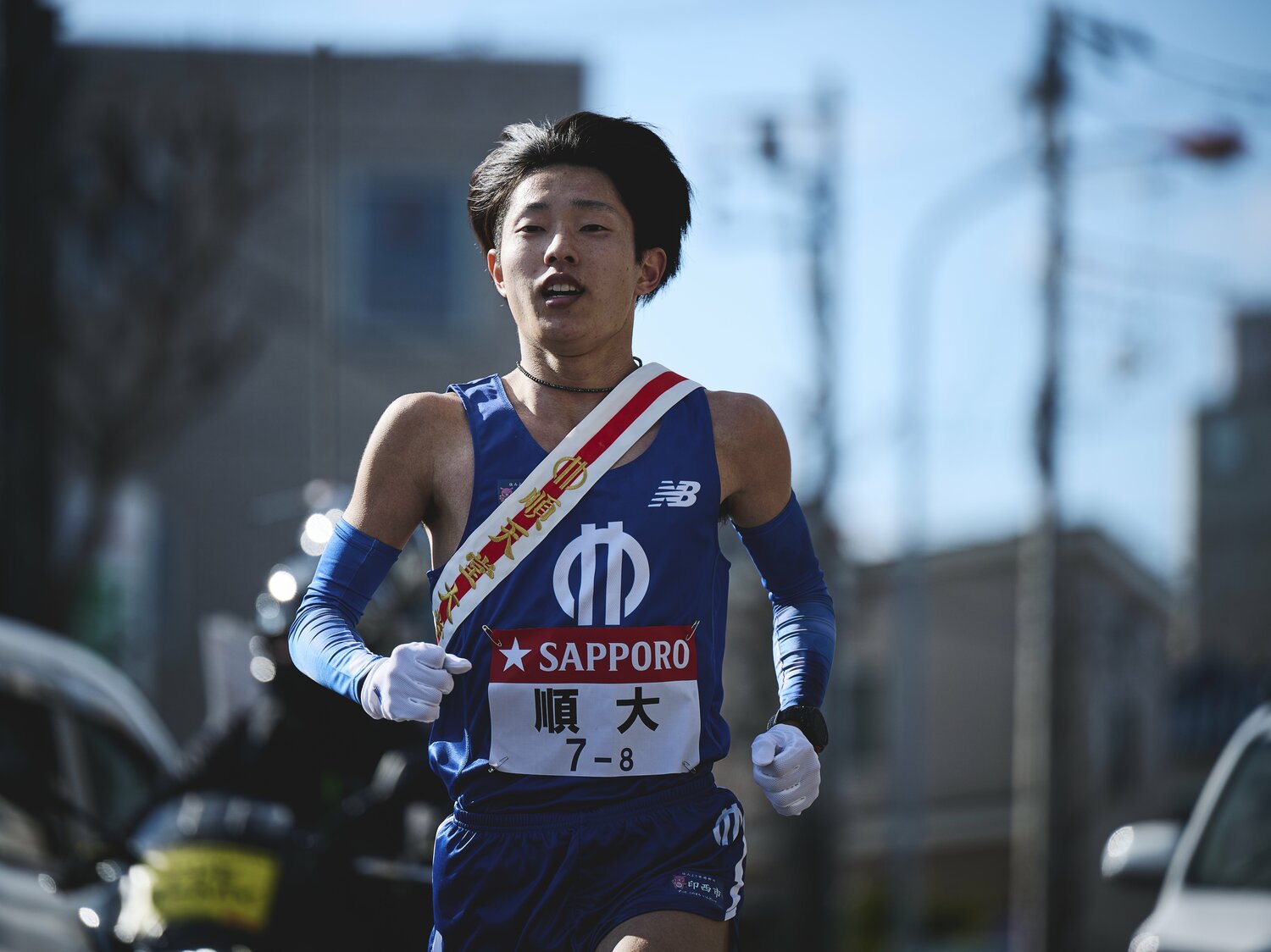 8区を走った津田。俳優の菅田将暉と一字違いの「つだまさき」としても話題になった　©️Yuki Suenaga