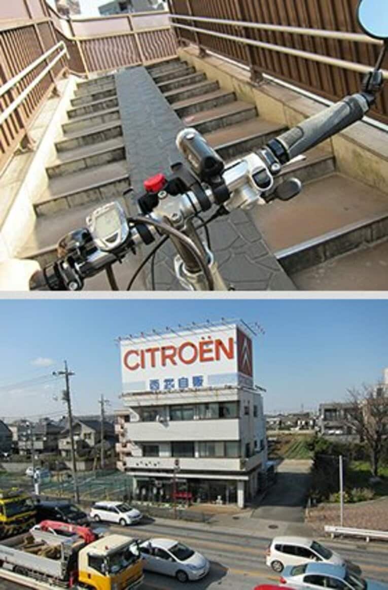 狭い急坂を自転車を押して上がるという大変な難所・谷原交差点の巨大歩道橋。懐かしい西武自販の看板が望める。　