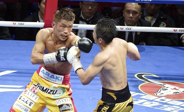 実績も技術も会場の後押しでも上回る相手ゾウ・シミンに、まさかの勝利。日本男子ボクサーが海外で世界タイトルを奪ったのは36年ぶりのことだった　©Getty Images