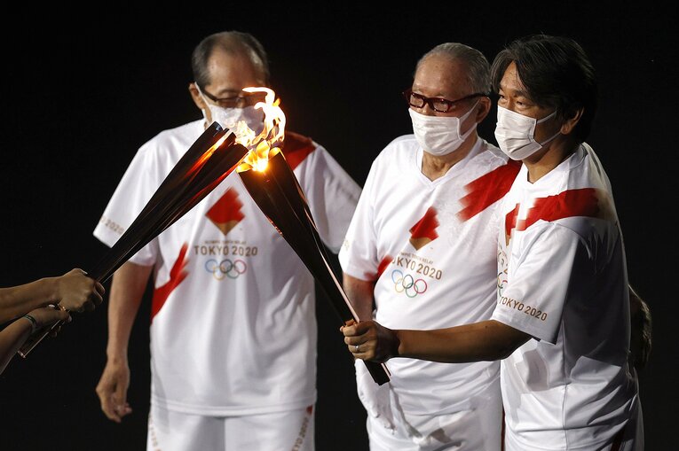 東京オリンピックで王貞治氏、長嶋茂雄氏とともに聖火ランナーを務めた松井　©Getty Images