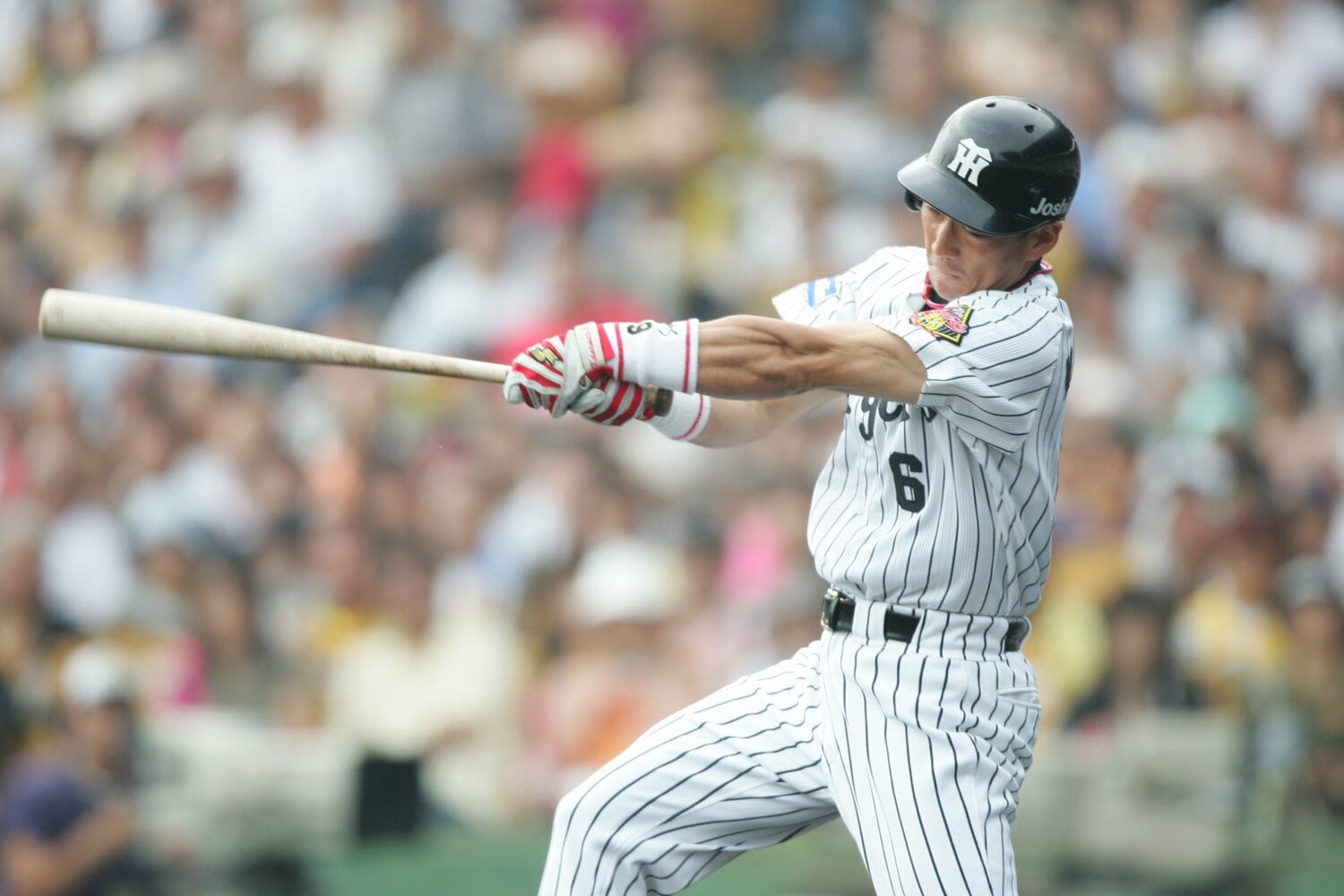 広陵で甲子園に出た経験のない金本。広島から阪神にFA移籍し、甲子園の舞台で躍動した ©Sports Graphic Number