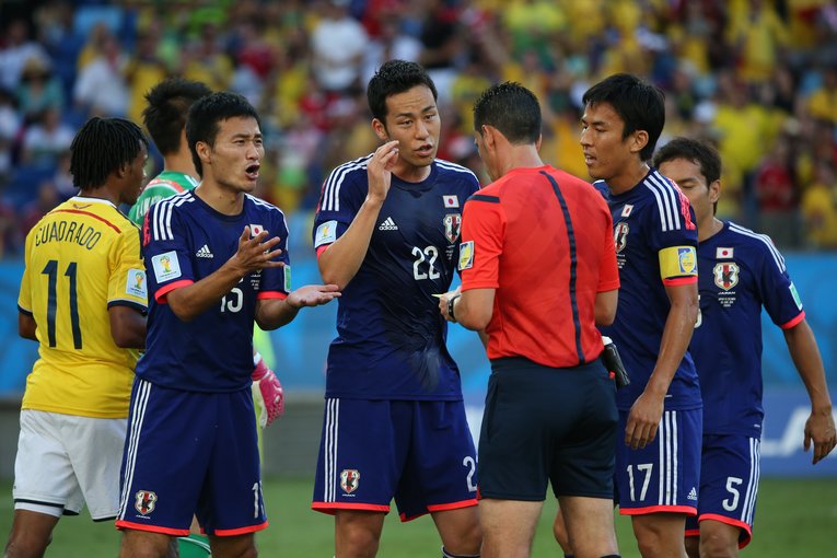 長谷部誠がつけていたキャプテンマークを引き継いだ吉田麻也（写真は2014年ブラジルW杯）©JMPA