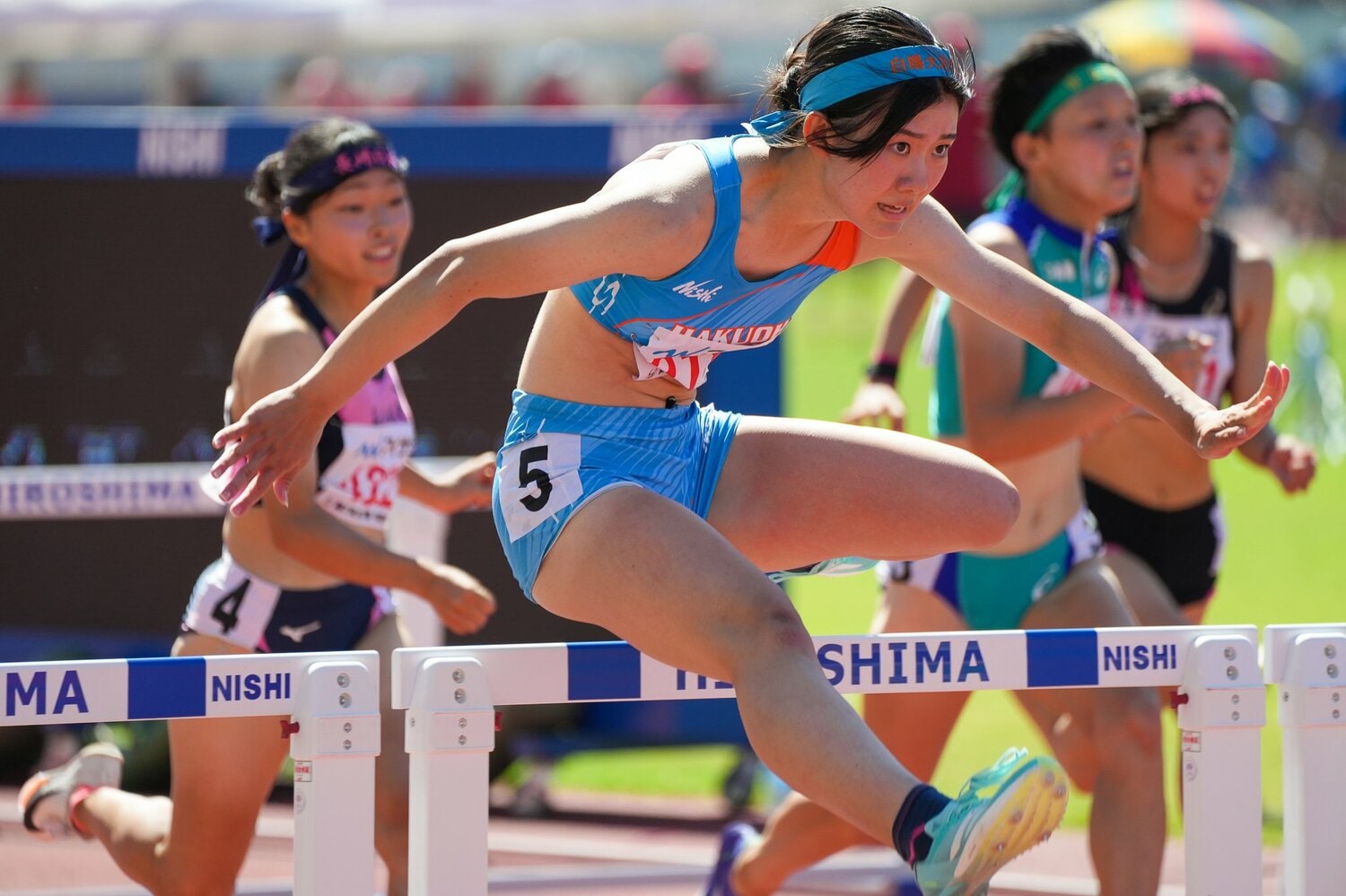 風にも恵まれた決勝1組目で高校新記録を出した石原　©Satoshi Wada