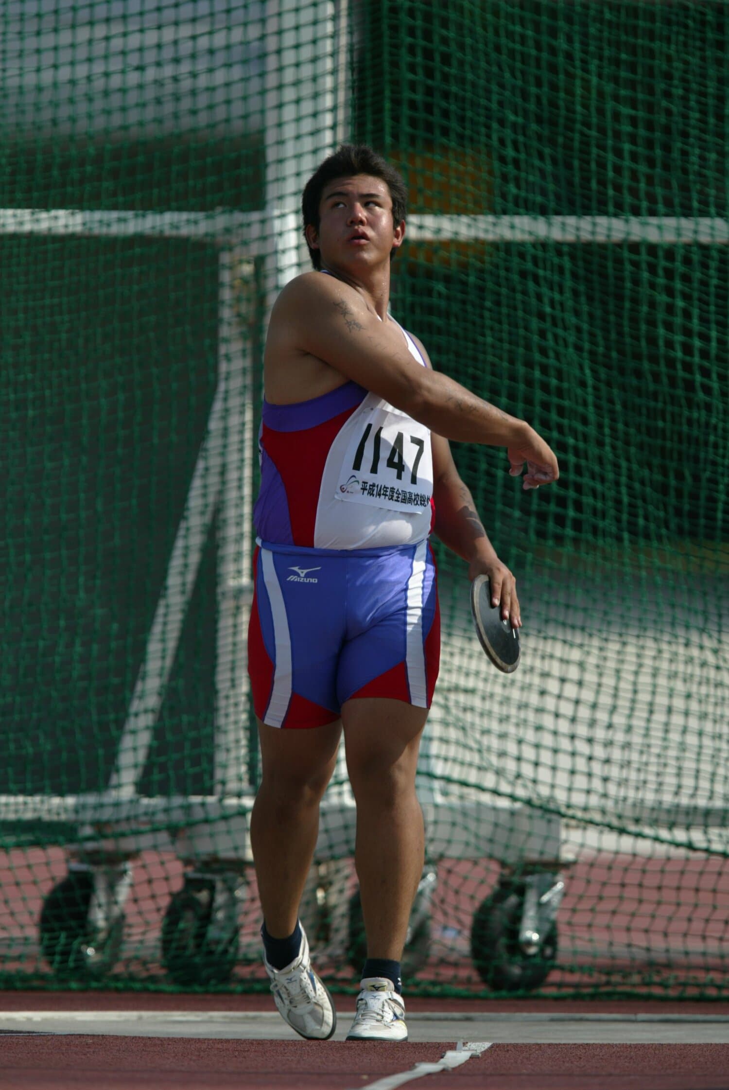 発熱などの体調不良もあったなかで円盤投げで4位に入った岡先　©Getsuriku