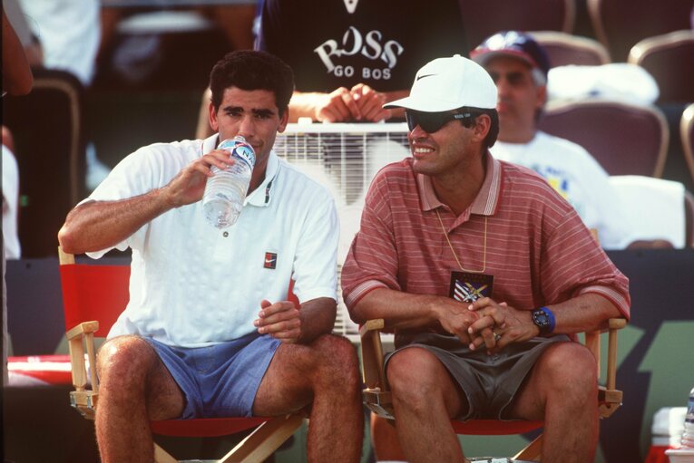 コーチのティム・ガリクソン（右）との2ショット　©Getty Images