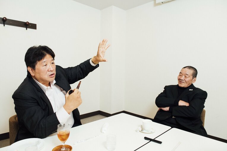 “不穏試合”の当事者・前田日明と当日セコンドについていた藤原喜明　©タイコウクニヨシ