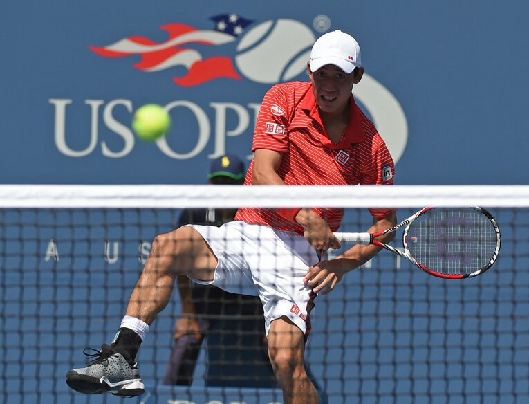 2014年全米オープン準決勝でジョコビッチと打ち合う錦織　©AFP/JIJI PRESS