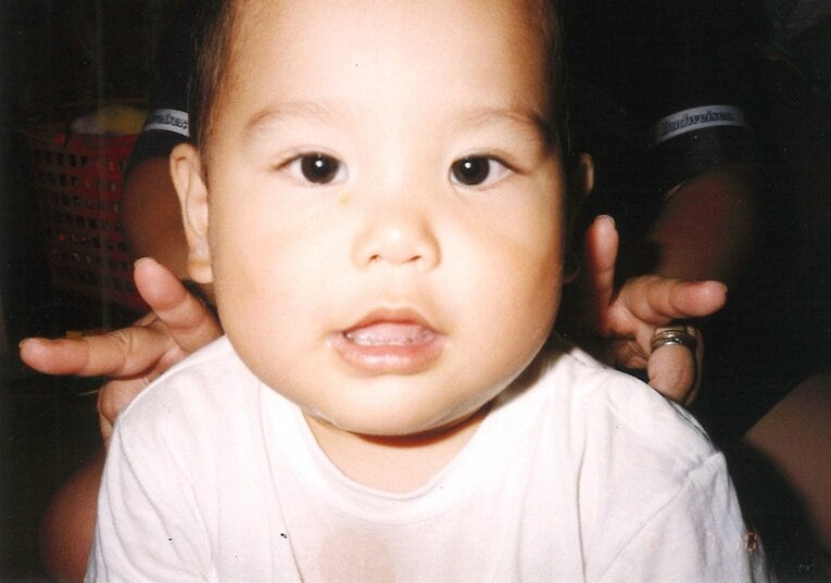 幼少期の西田有志（両親提供）