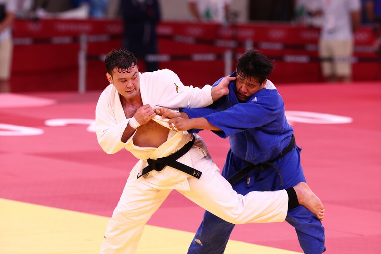 激闘となった東京五輪決勝。試合後にウルフは涙を浮かべた　©JMPA