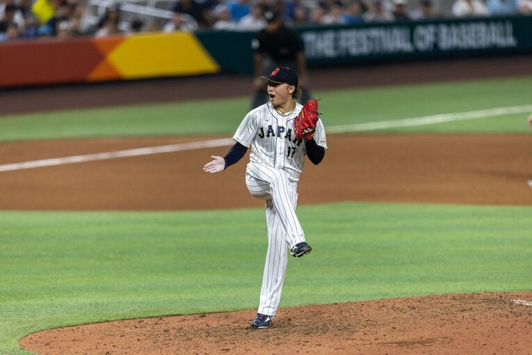 決勝のアメリカ戦、雄叫びをあげる伊藤の右手にロジンの跡　©AFLO