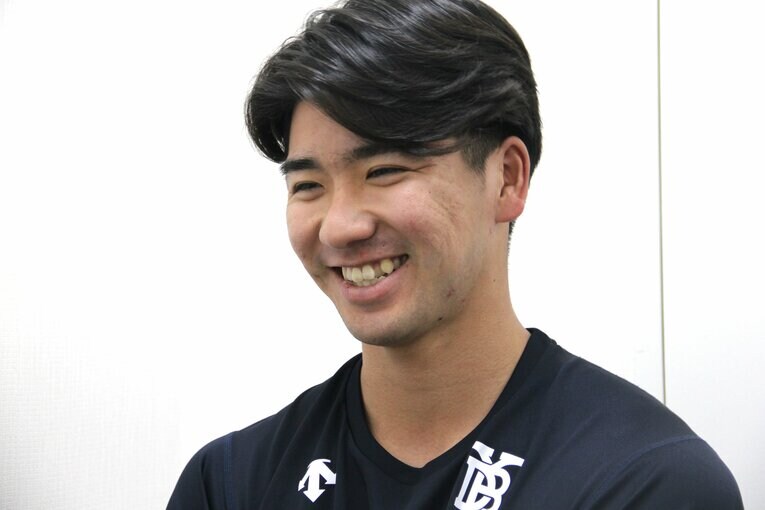 マウンドとは打って変わって穏やかな笑みを浮かべる篠木　©NumberWeb